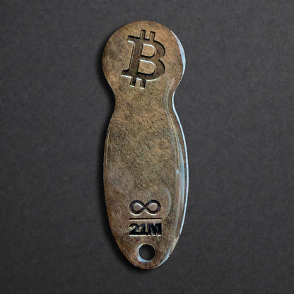 Bitcoin Einkaufswagenlöser aus Edelstahl in Dark Bronze frontal von oben fotografiert, kompakt und schlüsselbundtauglich
