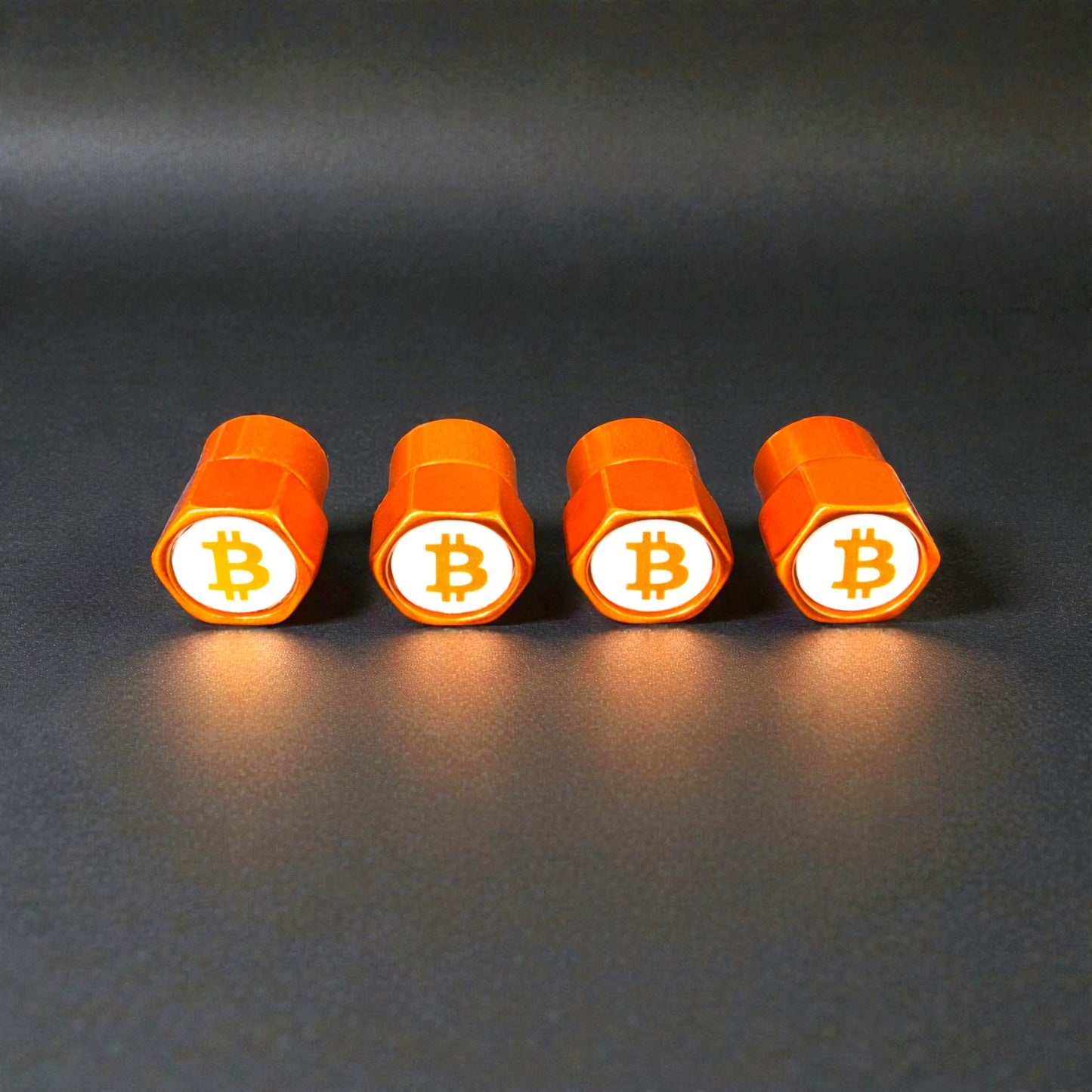 Orange Ventilkappen liegend nebeneinander